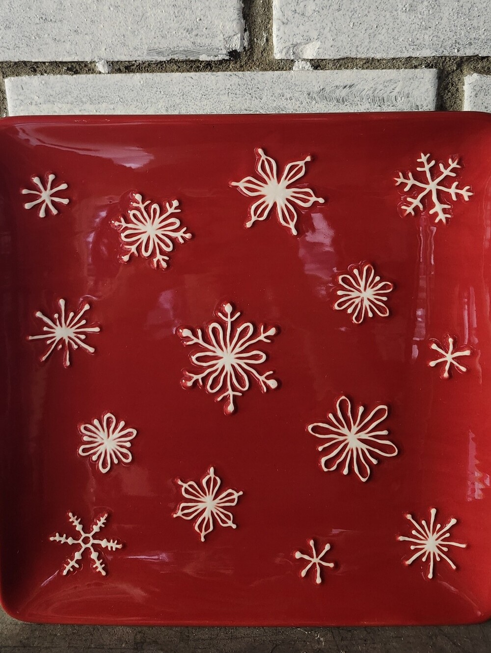 • St. Nicholas Square TREE LOT 9.5" Salad Plate Red White Embossed Snowflakes